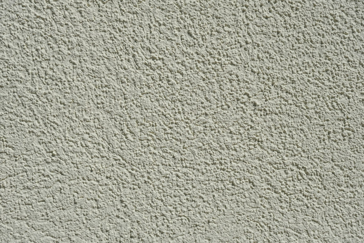 Close up of a textured cement wall surface suited to the Purdy Colossus 12 inch roller sleeve