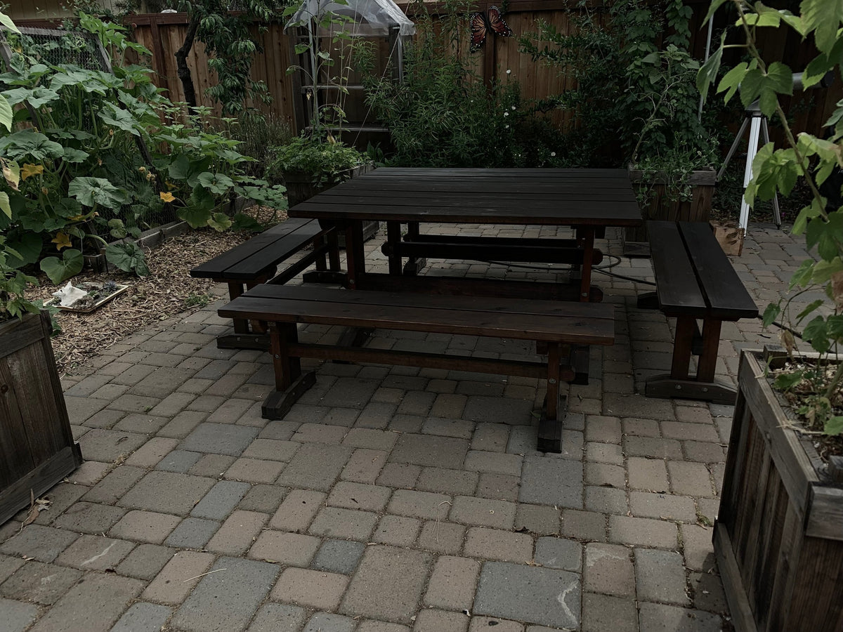 Finished outdoor wooden garden table and benches after oiling
