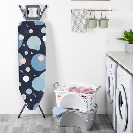 Person fitting a new ironing board cover onto a standard ironing board