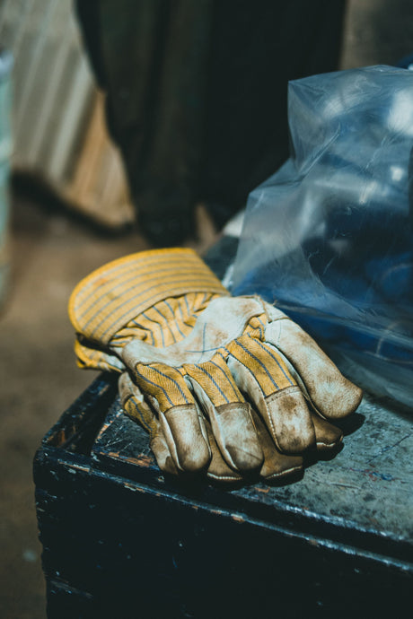 Close up of protective work gloves on a workbench
