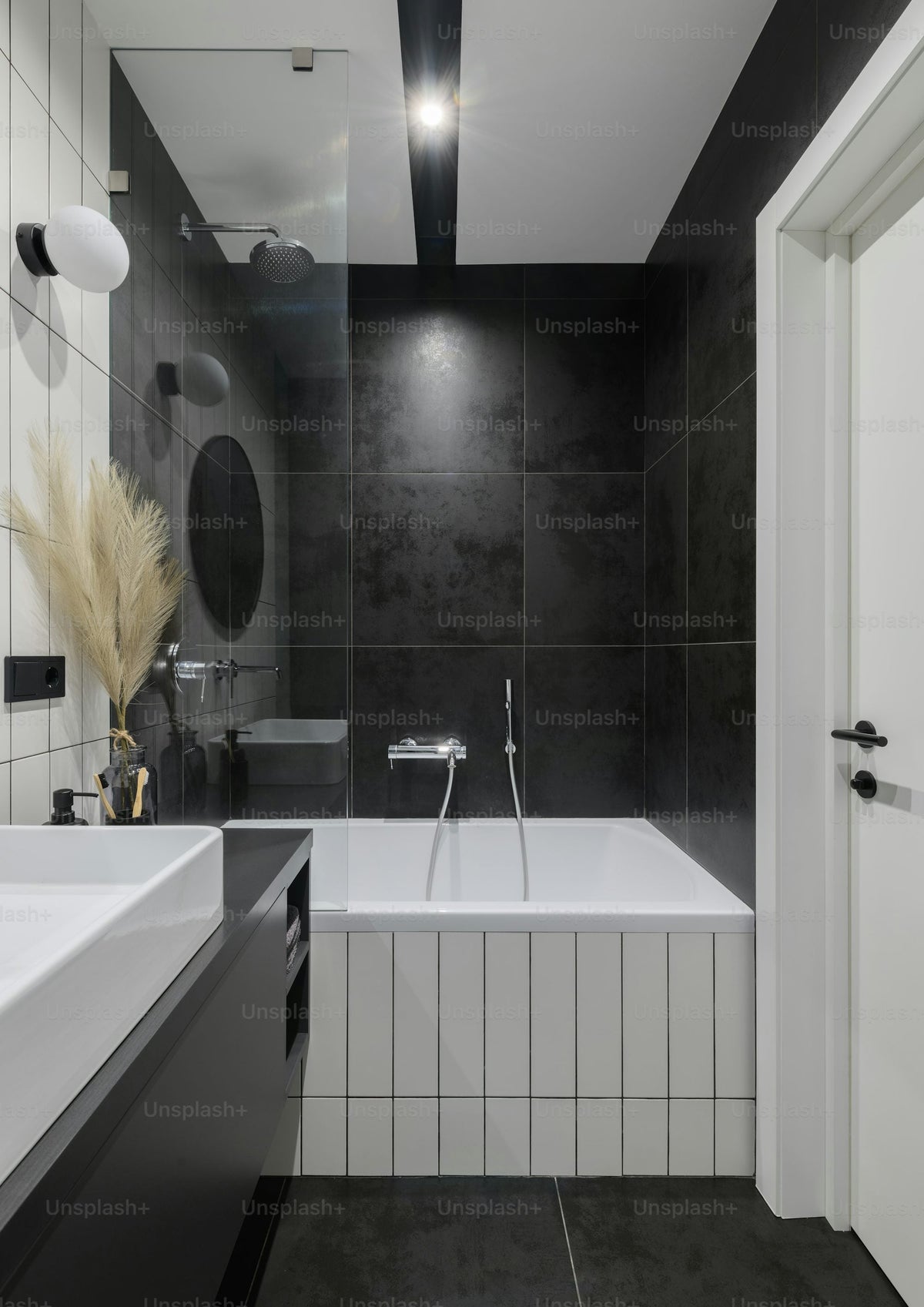 Black and white monochrome bathroom with bathtub and sink
