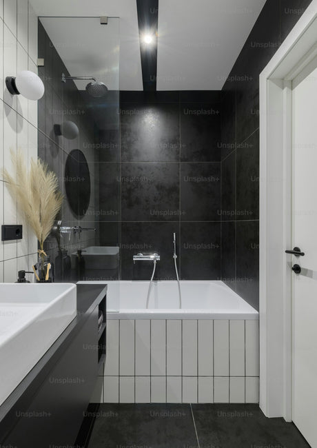 Black and white monochrome bathroom with bathtub and sink