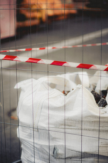 Heavy duty rubble sack filled with construction waste at a building site