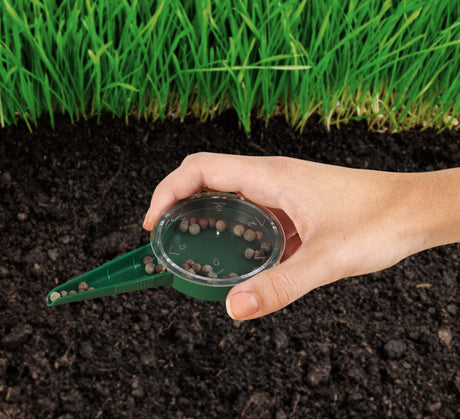 Ambassador dial seed sower, a handheld gardening tool with a rotating dial used to sow individual seeds evenly spaced.