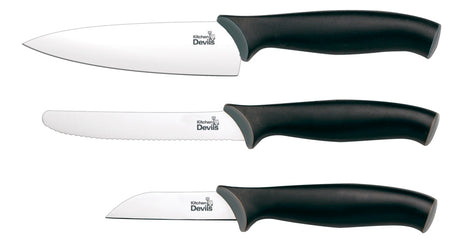 Kitchen Devils Control Starter Set knives laid out showing paring knife, multi-purpose knife and small cook's knife with black ergonomic handles