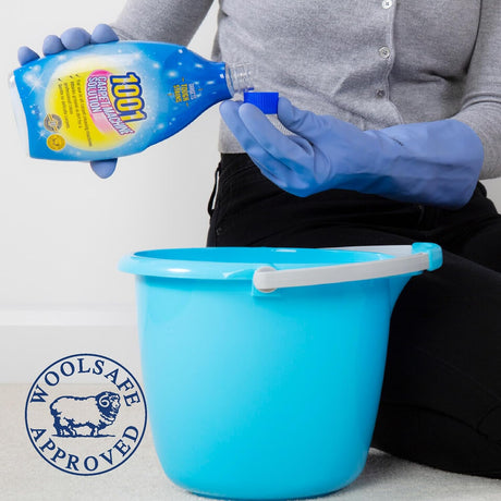 Pouring 1001 Carpet Machine Solution into a bucket ready for use in a carpet cleaning machine