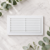 White plastic 9x6 louvre vent grille with visible internal flyscreen mesh