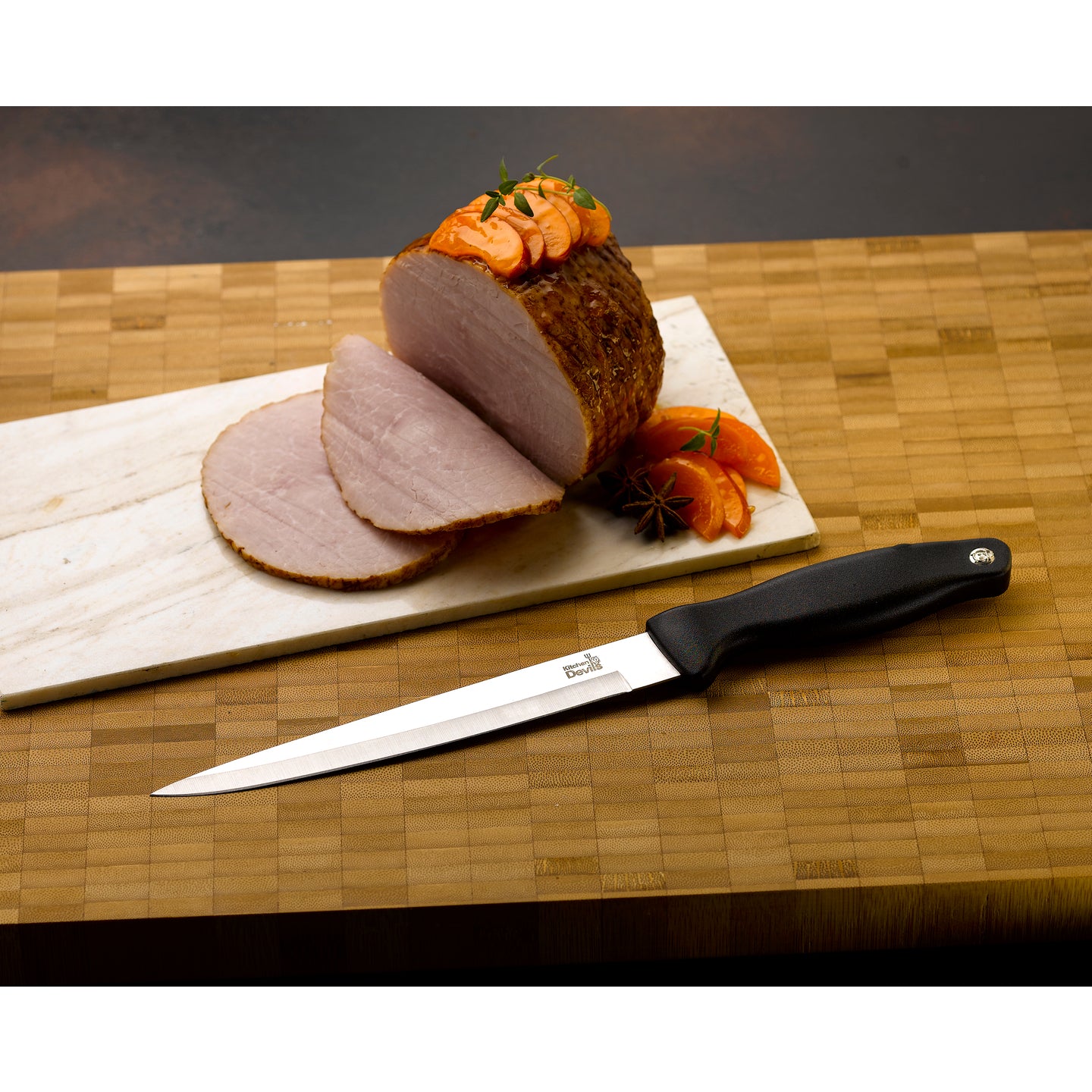 Kitchen Devils Carving Knife carving a roast joint