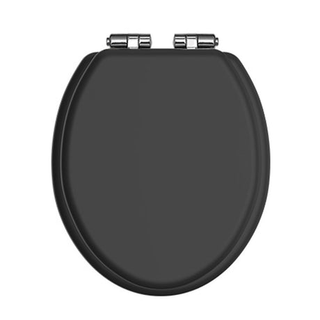 Black toilet seat with chrome-plated hinge fittings, close-up detail