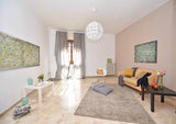Spacious modern living room with a large area carpet, the kind of high-traffic space 1001 Carpet Shampoo is designed for