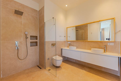 Elegant minimalist bathroom with beige tiles and large mirror, styled in Dulux Egyptian Cotton tones