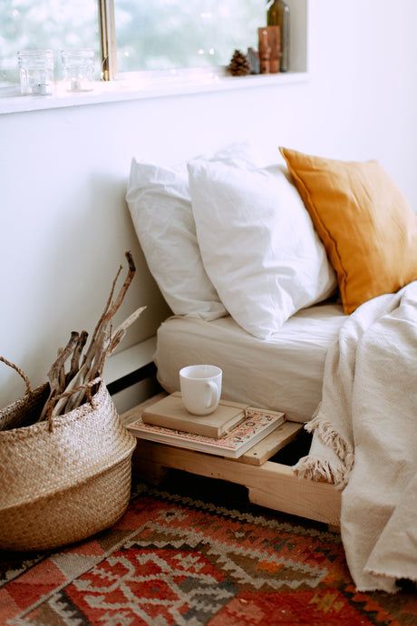 Cosy bedroom in warm beige and cream tones with natural light