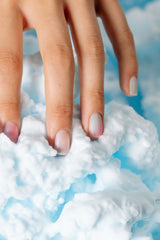 Close-up of thick white foam mousse texture, similar to 1001 Mousse carpet cleaning foam