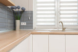 Minimalist kitchen with beige furniture facades matching Dulux Egyptian Cotton tones