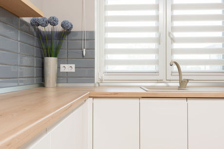 Minimalist kitchen with beige furniture facades matching Dulux Egyptian Cotton tones