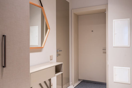 Corridor with beige doors and cabinet, coordinating hallway tones near Egyptian Cotton trim