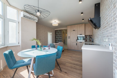 Spacious studio kitchen with beige kitchen furniture close to Dulux Egyptian Cotton