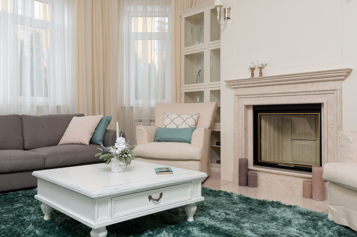 Bright living room with a soft, clean green carpet after stain treatment