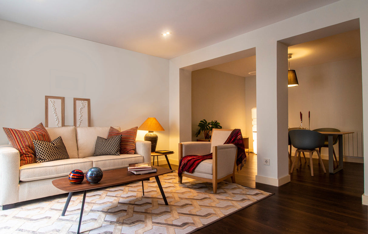 Cozy, bright living room with warm natural light and soft furnishings