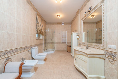 Spacious bathroom with beige tiles and modern fixtures, suited to Dulux Egyptian Cotton