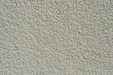 Close up of a textured cement wall surface suited to the Purdy Colossus 12 inch roller sleeve