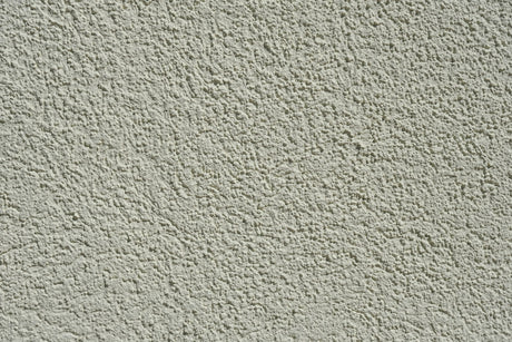 Close up of a textured cement wall surface suited to the Purdy Colossus 12 inch roller sleeve