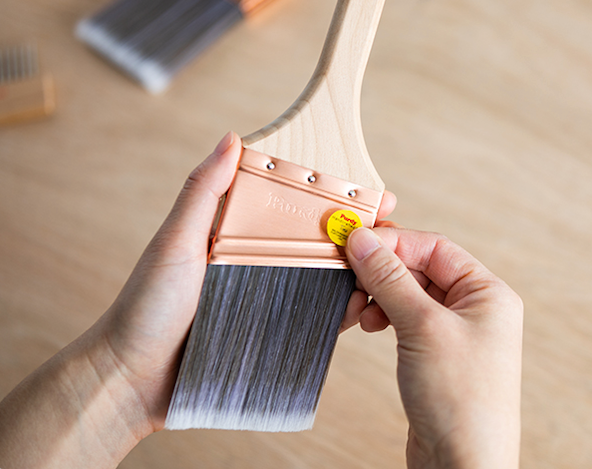 Purdy Brush and Roller Cleaner shown in a how to use demonstration